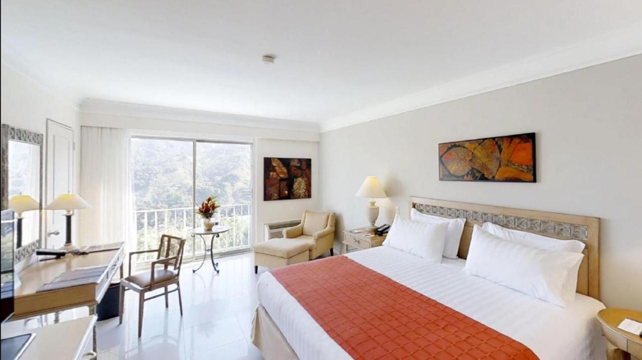 Hotel Estelar Altamira Ibagué Exterior foto A room at the hotel